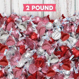 Zisbers Valentines Kisses wrapped treats on dessert table for party snacking.