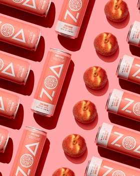 ZOA branding close-up highlighting vitamin C and B-vitamins blend.