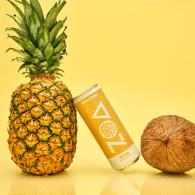 ZOA Pineapple Coconut pouring into a glass for refreshment on the go