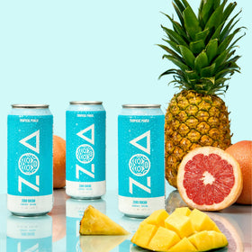 ZOA Tropical Punch pour into glass highlighting refreshing flavor and zero sugar energy