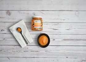 Zocalo Organic Aji Amarillo Paste on a spoon ready to flavor.