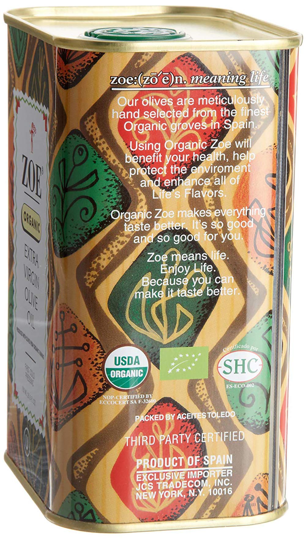 Pouring ZOE Organic EVOO over a fresh salad for a bright finish