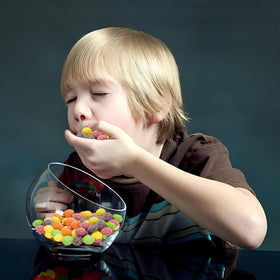 ZompoZ flavors on a plate, grape, lemon, strawberry, orange, lime for snacking variety.
