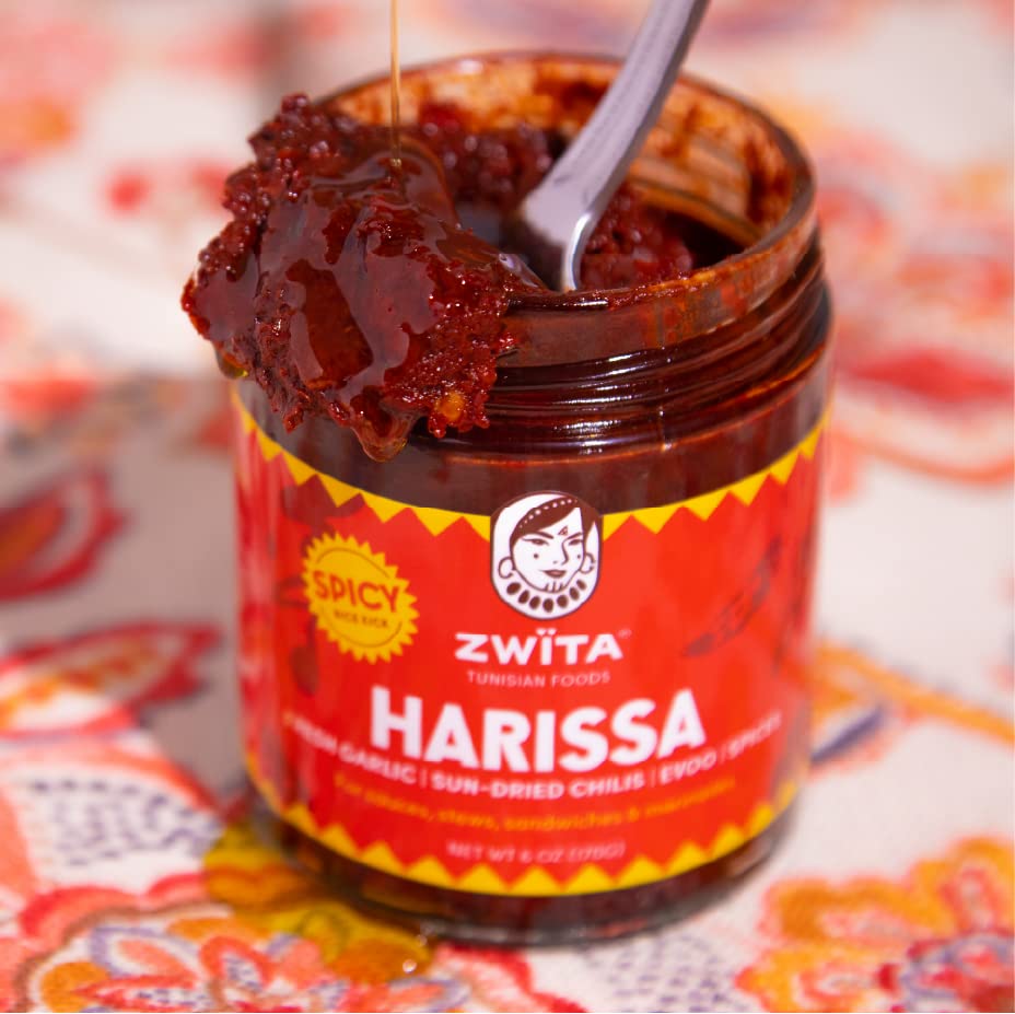 Zwita Spicy Harissa bottle pour demonstrates rich texture.