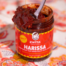 Zwita Spicy Harissa bottle pour demonstrates rich texture.