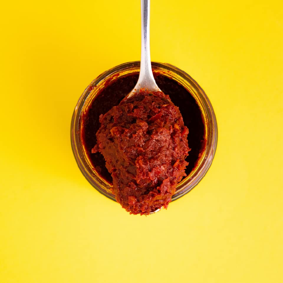Zwita Spicy Harissa jar back label highlights ingredients and spice balance.