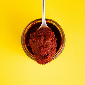 Zwita Spicy Harissa jar back label highlights ingredients and spice balance.